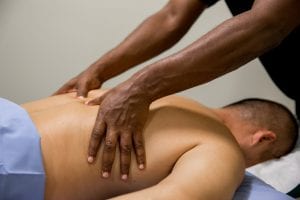 massage therapy school student in practice