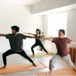 A diverse group of people doing yoga