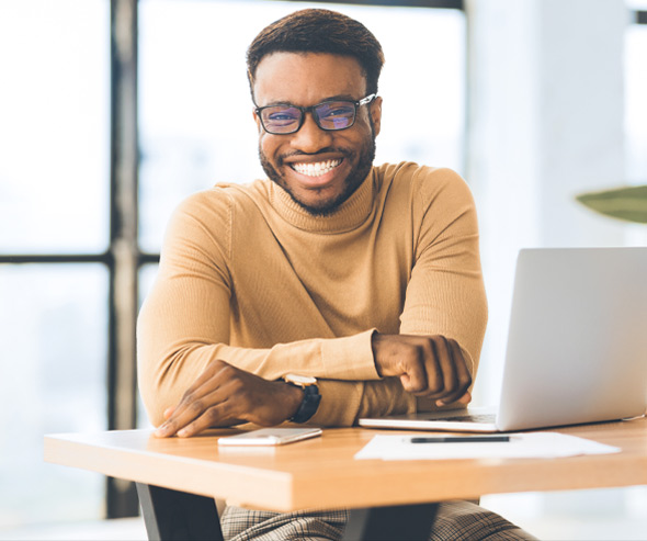 man smiling sitting at table