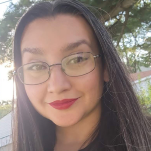 A headshot of a person wearing glasses.