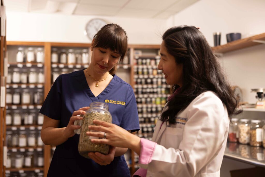 Student studying Chinese herbal medicine as part of acupuncture degree training at PCHS