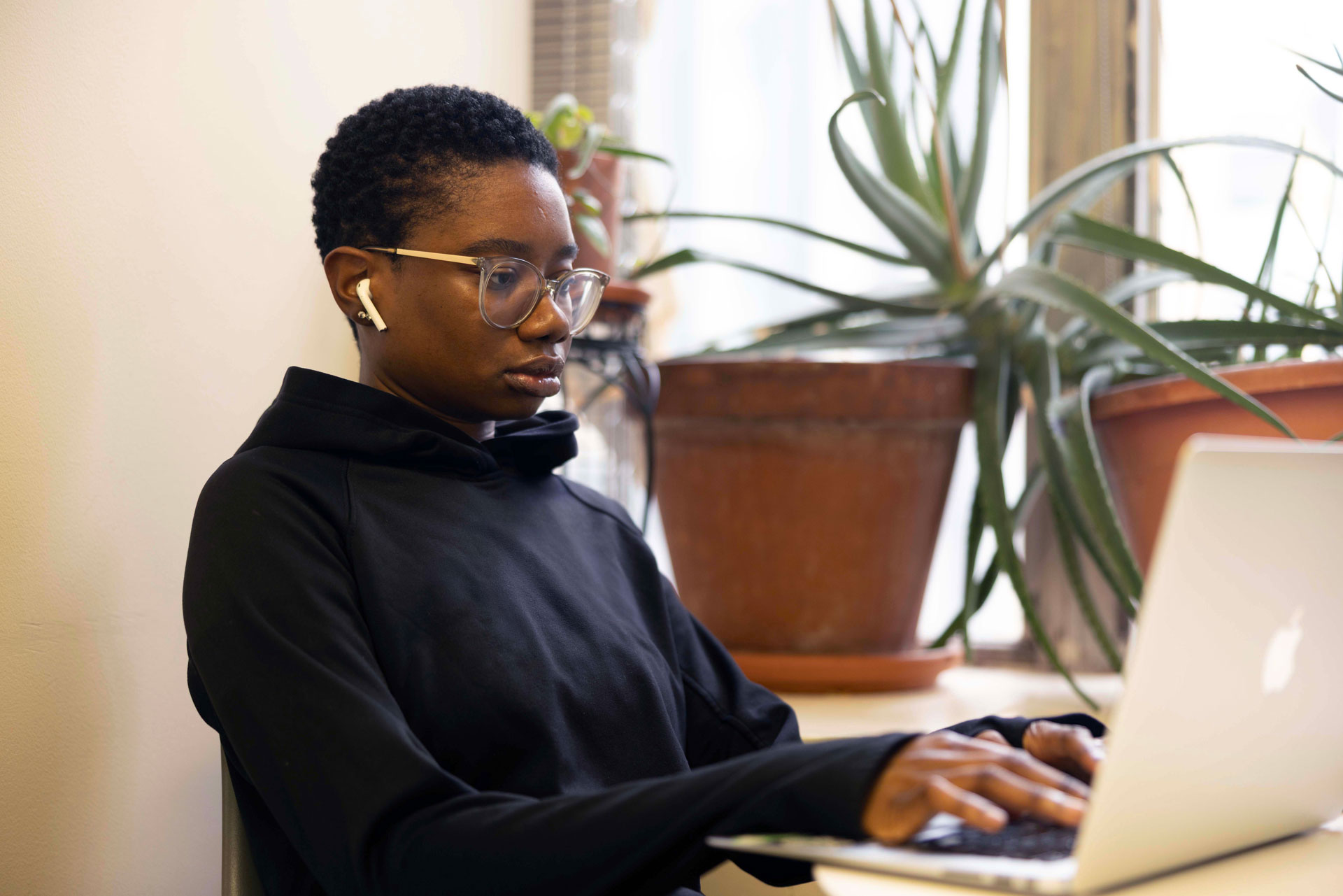 Prospective student reviewing acupuncture school information on a laptop to compare programs